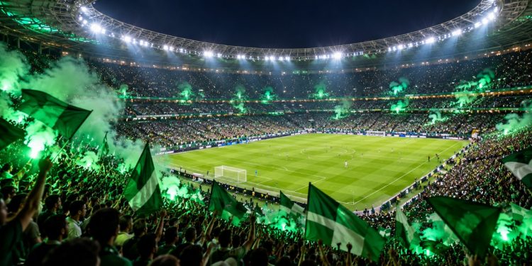 Estádio de futebol lotado à noite em jogo decisivo
